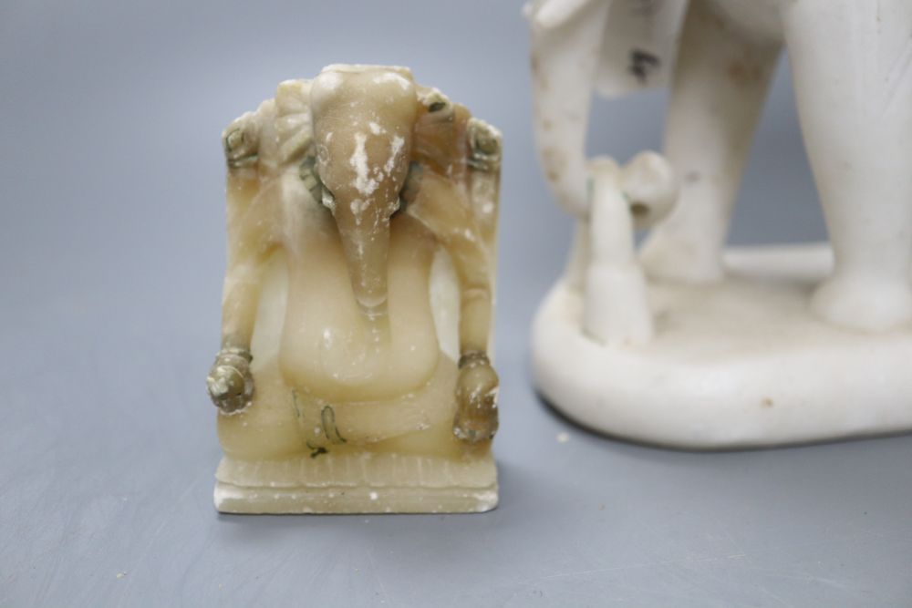 An Indian white marble elephant group, height 22cm and two soapstone elephants